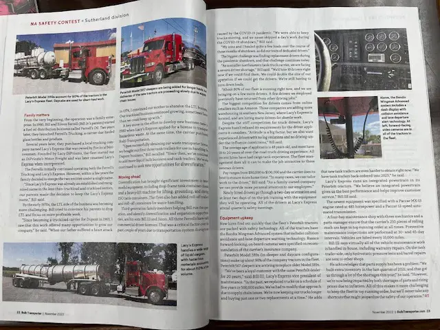 Magazine opened to article of red trucks